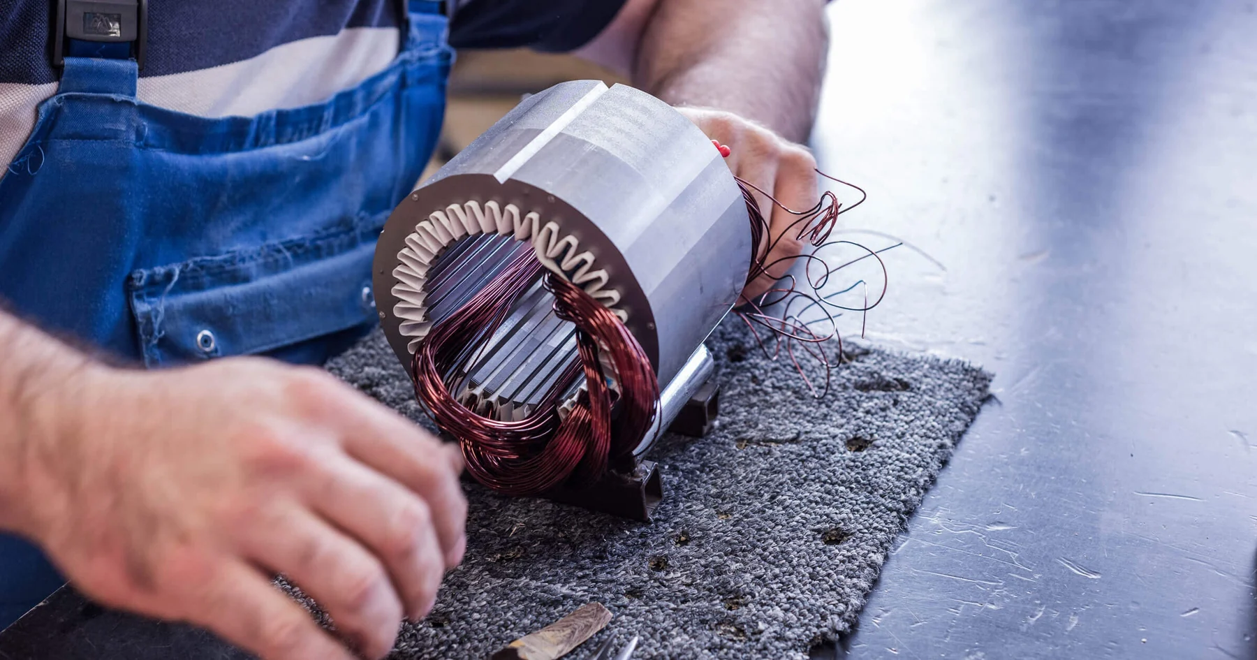 Technician assembling a precision motor stator for OEM motion systems